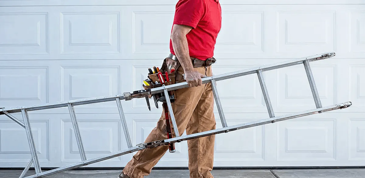 Garage door repair technician arriving with tools and ladder in Hialeah, FL