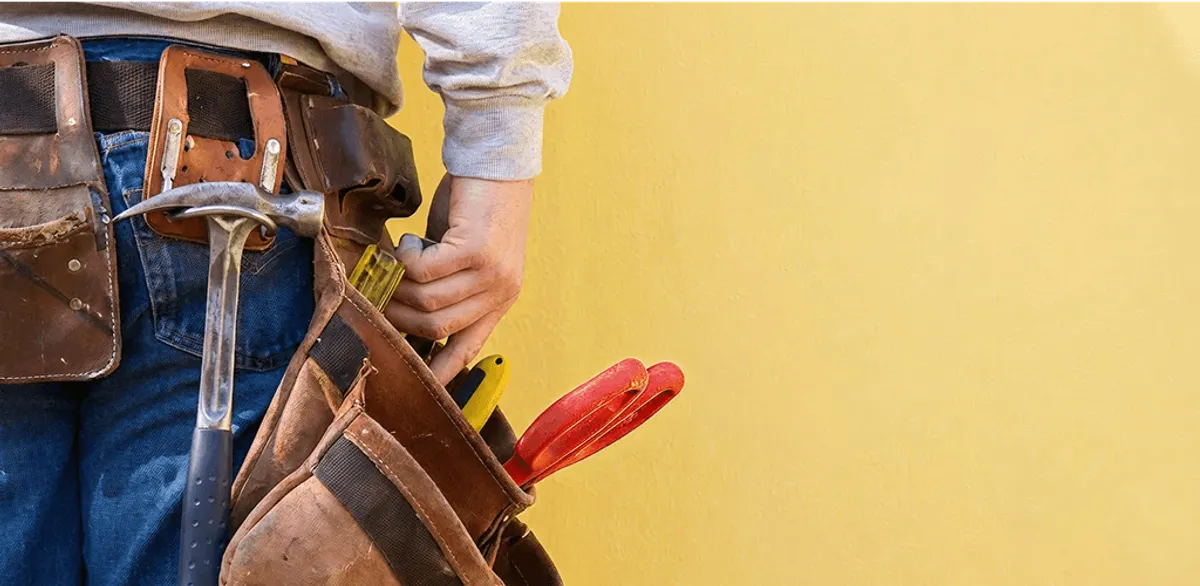 Handyman with tool belt ready for home repairs and maintenance in Hialeah, FL